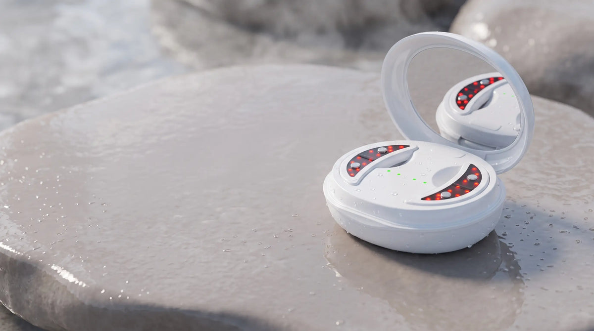 The Rest’s charging case open on a grey stone