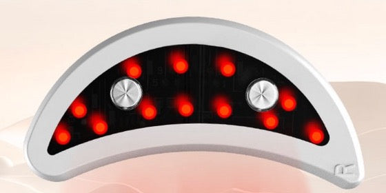 Close-up of one crescent-shaped device with its 12 red LEDs glowing